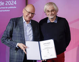 Auszeichnungen für politische Karikaturen und Fotografien